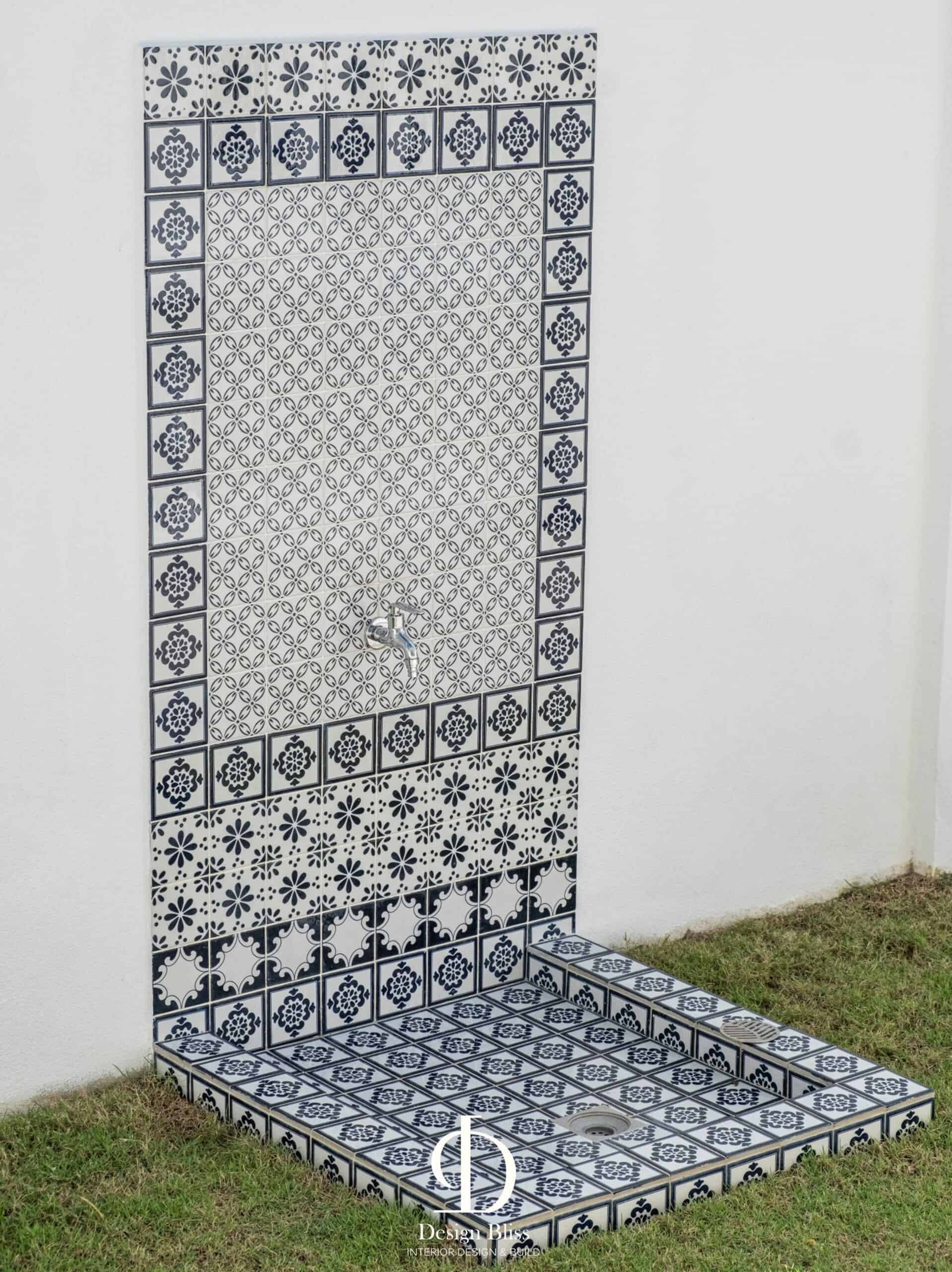 Blue-and-white patterned outdoor tile feature at Véra Maison bungalow in Malaysia