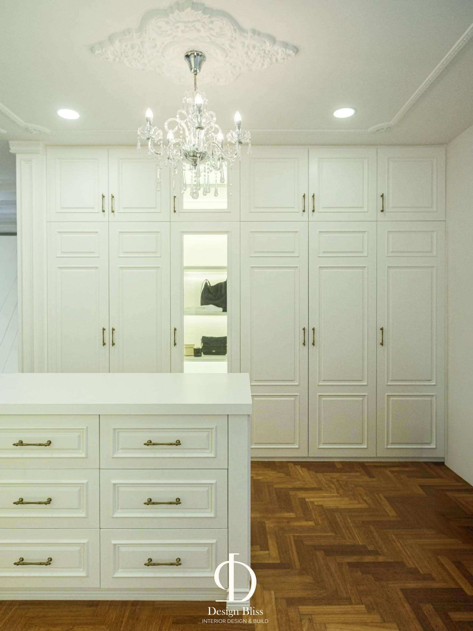 Véra Maison custom white wardrobe cabinetry with classic panel doors and gold handles