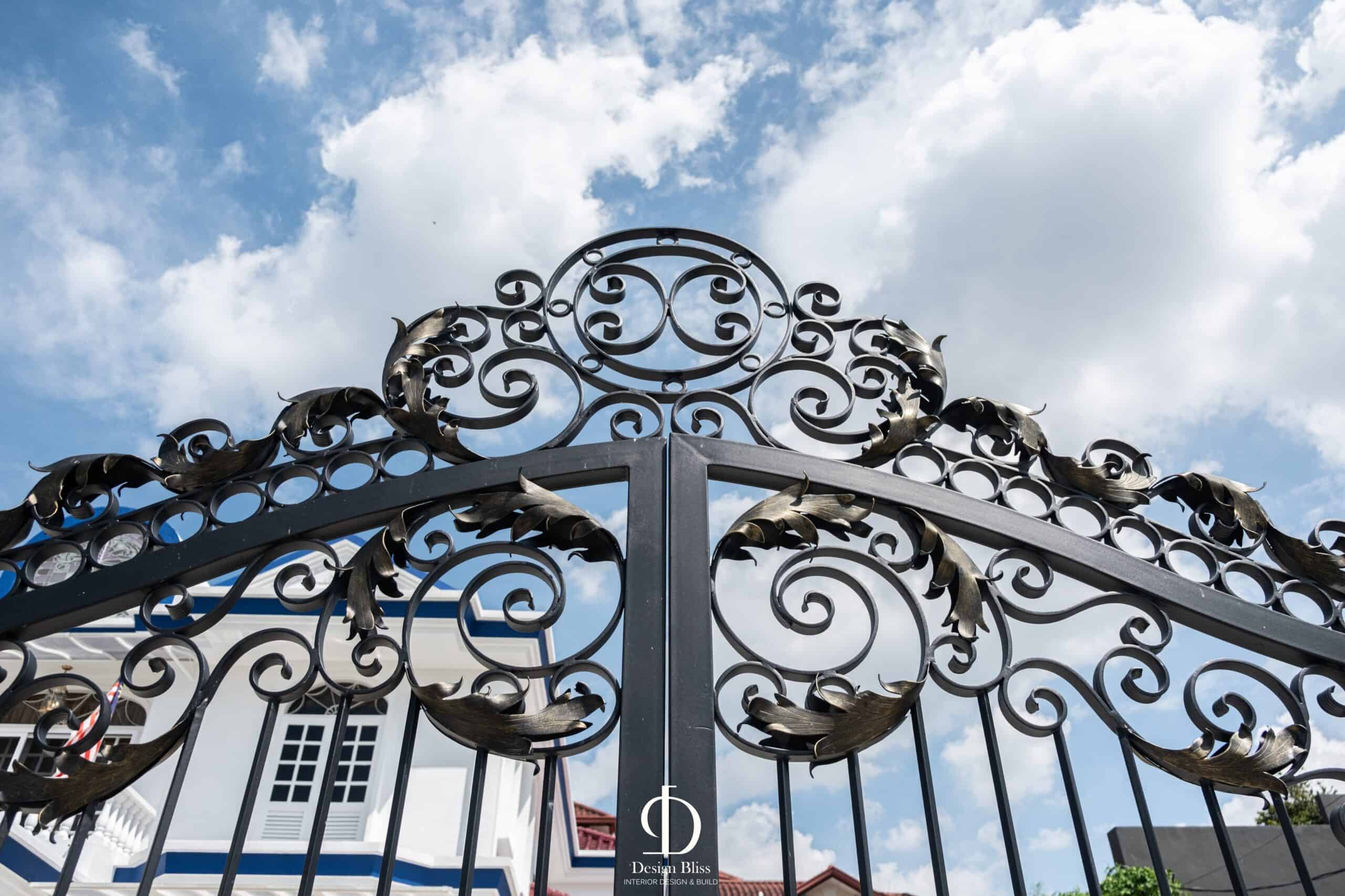 Ornate wrought-iron entrance gate at the Véra Maison contemporary classic bungalow